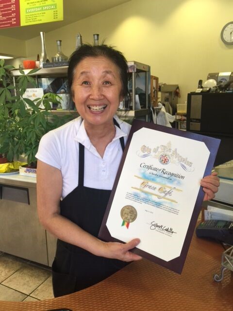 Owner of Grace Cafe awarded a certificate of recognition