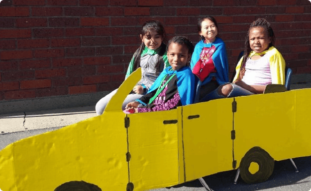Elementary kids learning and playing during an educational workshop
