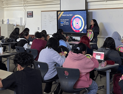 High school students participating in a distracted driving prevention workshop